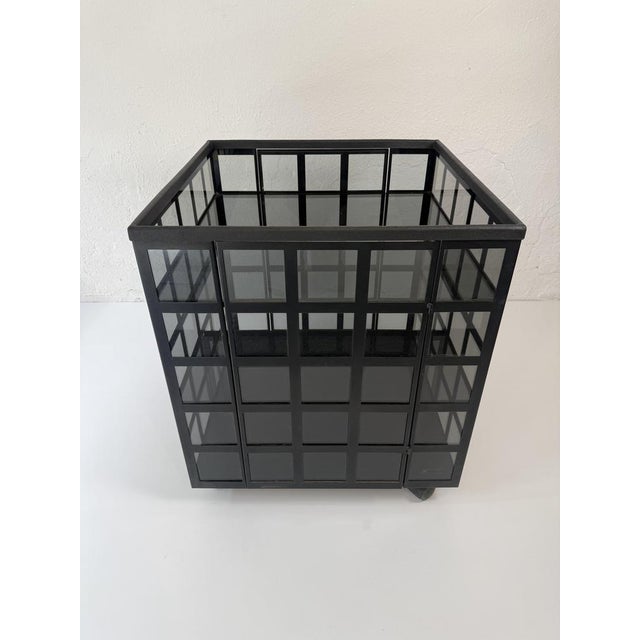 "Go Go" bar cart designed by Anna Anselmi for Bieffeplast in the 1970s. The frame is made of black powder-coated metal and...