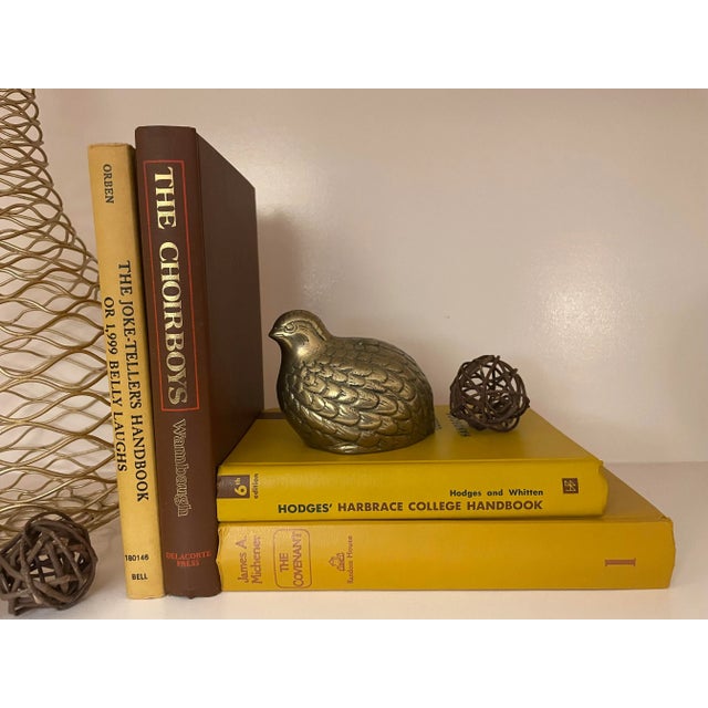 Add color and interest to your shelf or coffee table with this rare collection of gold and chestnut brown vintage books....