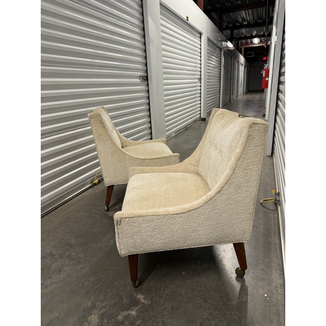 A nicely scaled pair of very versatile slipper chairs. The size is ideal for a low pair od side by side tailored Wm....