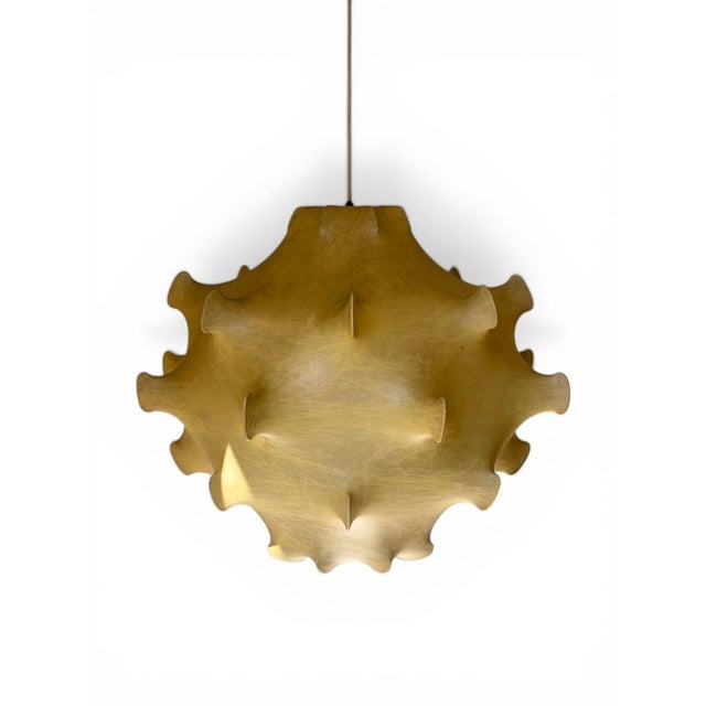 Elevate your architectural project with a true luminous sculpture. The majestic taraxacum pendant, a 1960s castiglioni...