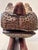 This expressive hand‑carved wooden sculpture depicts a stylized animal, likely a feline, rendered with bold form and...