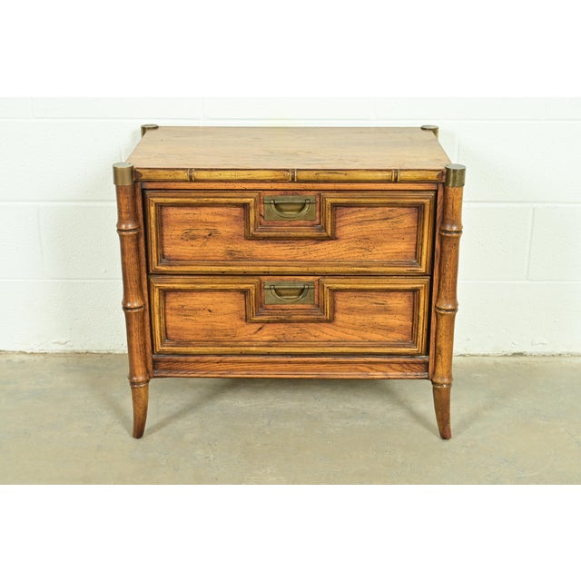 A beautiful mid-century modern Hollywood Regency Campaign nightstand or end table By Stanley Furniture USA, Circa 1960s...