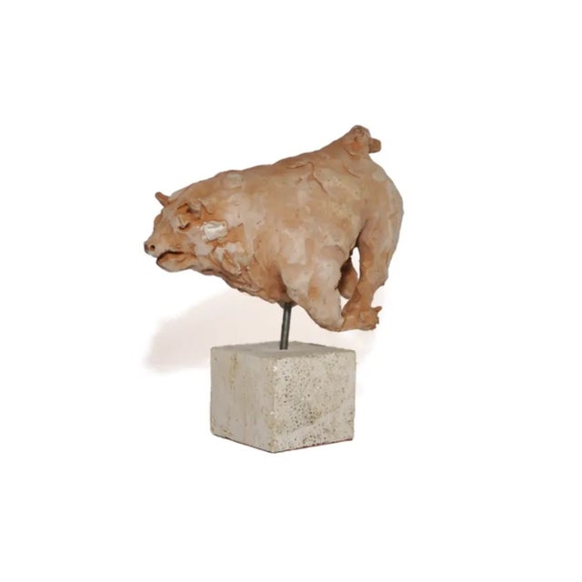 Sculpture realized by the artist Mario Bertozzi in terracotta representing a "bull" with marble base and engraved...