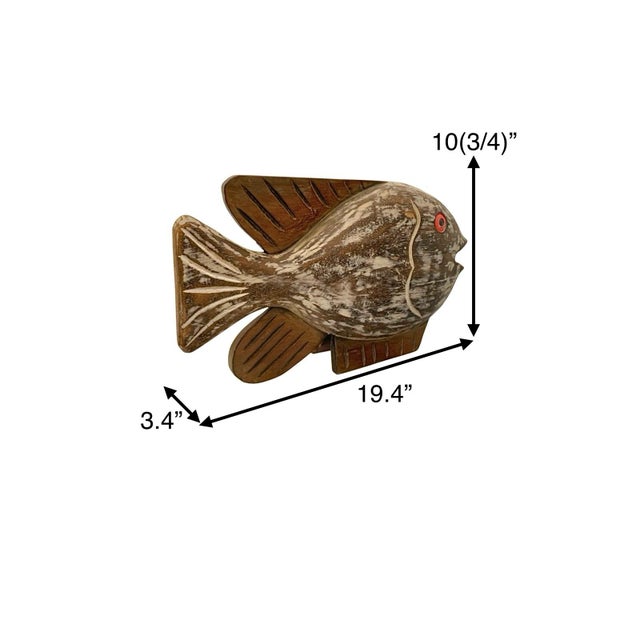 This is a vintage hand-carved fish figure that embodies a tropical coastal nautical theme. This unique piece of decor adds...