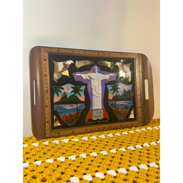 A charming antique Brazilian butterfly wing tray depicting the iconic Christ the Redeemer monument overlooking Rio de...