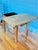 A beautifully aged Arts & Crafts oak game table, dating to approximately 1900–1910, featuring a rare rotating top and...
