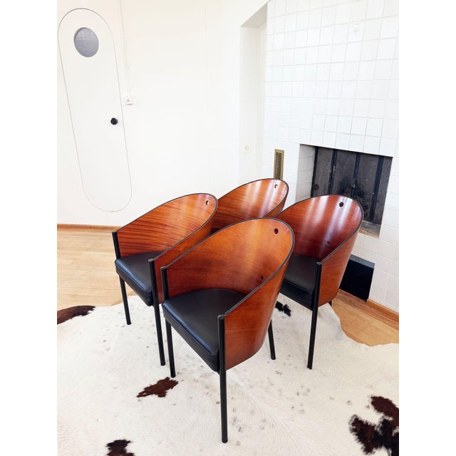 A set of 4 "Costes" chairs by Starck. Note: an additional pair of slightly lighter colored Costes chairs are also...