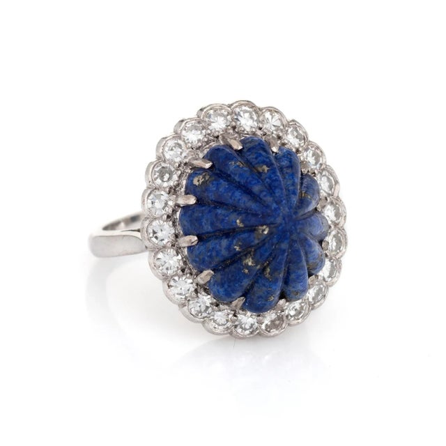 This is part of Chairish’s Fine Jewelry assortment. Stylish vintage fluted lapis lazuli & diamond cocktail ring (circa...
