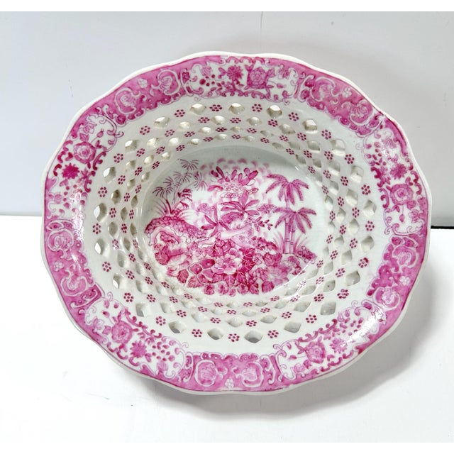 Striking vintage reticulated porcelain bowl in a pink-and-white chinoiserie pattern with pierced lattice sides, scalloped...
