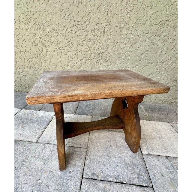 Antique hand made solid wood footstool or milking stool. It is very solid and heavy and can be used for so many purposes...