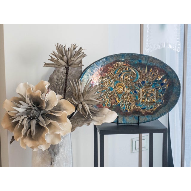 "Dance of the Jellyfish" is a Raku ceramic work born from a reflection on the fluid movement of life and matter. The...