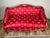 This Early 19th Century French Regency style settee features an elegant, gently serpentine form inspired by early 19th-...