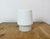 Vintage industrial ceiling or wall light made in former Czechoslivakia during the 1970s. It features a white porcelain...