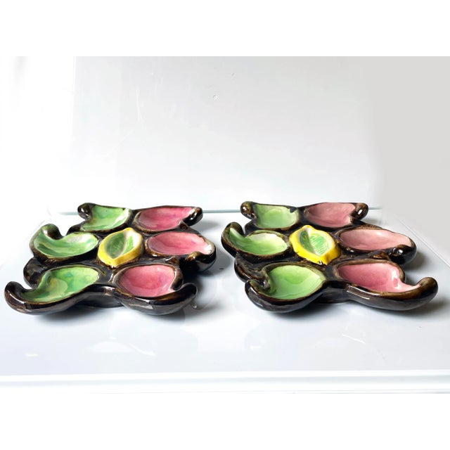 Beautiful pair of Hand painted French Mid-Century Vallauris Oyster Plates. Marked "decoy moiy Ch.M.R." on bottom.