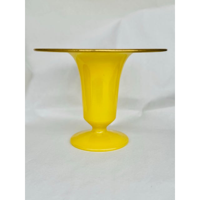 Bright, bold, and undeniably charming, this vintage handblown glass vase is a striking example of mid-century glass...