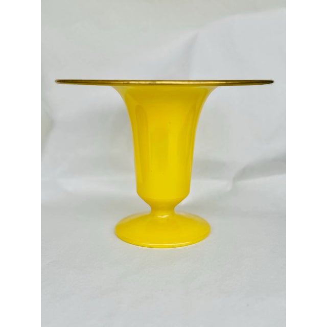 Bright, bold, and undeniably charming, this vintage handblown glass vase is a striking example of mid-century glass...