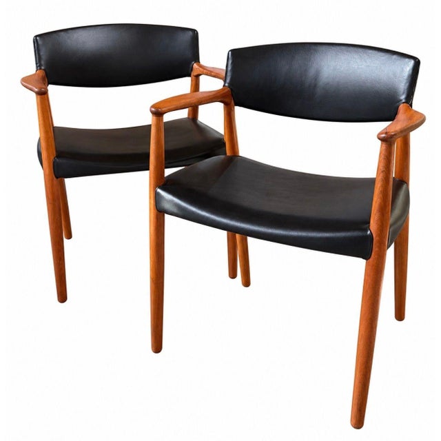 Ejner Larsen & Aksel Bender Madsen Teak and Leather Dining Captain Chairs for Willy Beck, 1950’s Denmark. Pair of side...