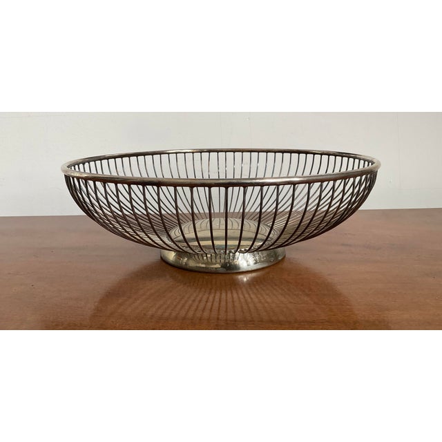 Serve up your warm dinner rolls with a side of 1960s Italian charm! This vintage silverplated wire basket brings...