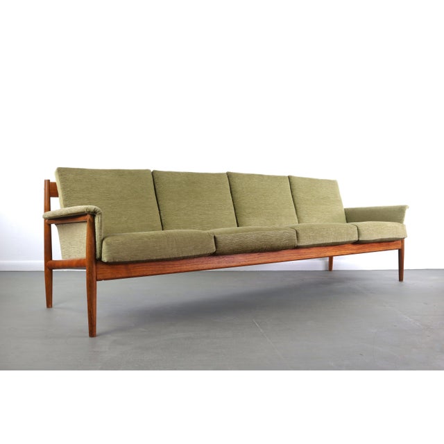 An especially rare, extra-long iteration of Grete Jalk's sculptural sofa for France & Son. This four-seat sofa features...