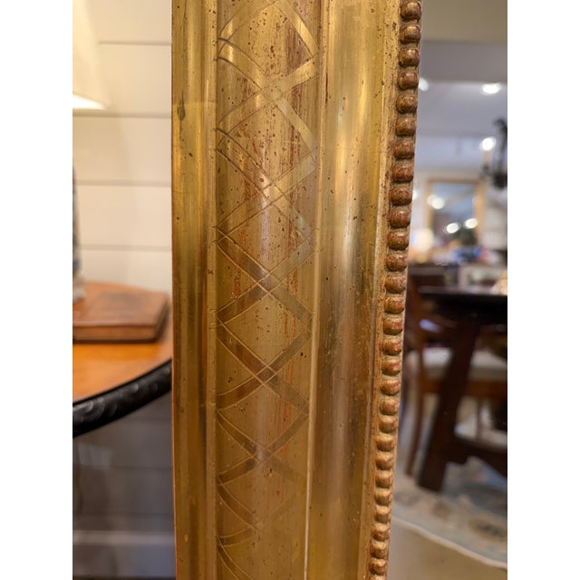 This exquisite Louis Philippe Mirror, adorned with a gilded finish, effortlessly brings timeless charm to any space. Its...