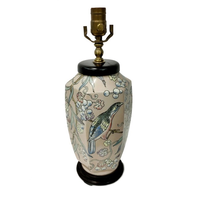 Vase lamp featuring branches with berries and flowers and detailed illustration of birds all around. Drawn in traditional...