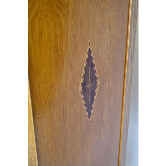 Light mahogany secretary decorated with inlaid wood decorations and brass handles from around the 1790s. Measurements in...