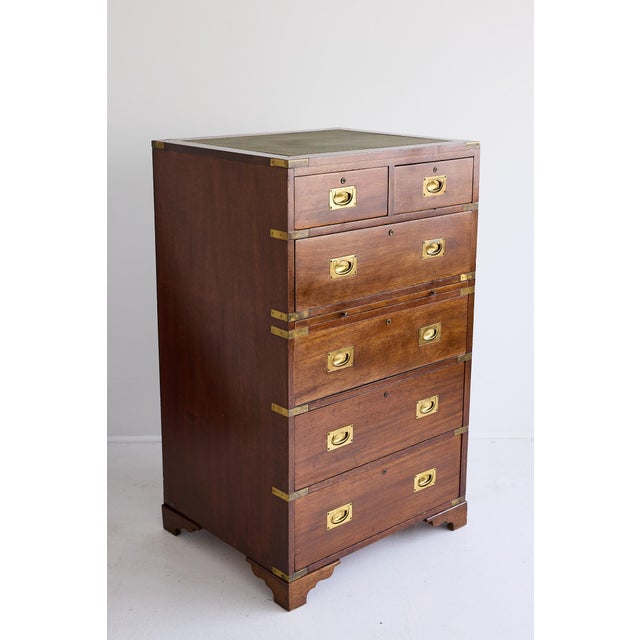 A fine example of an English campaign chest and secretary combination that combines practical military design with refined...