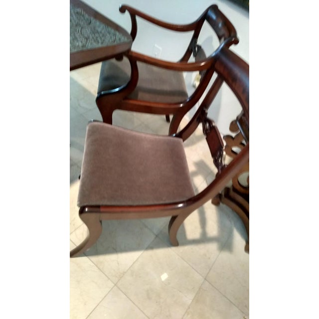 Partial set of numbered Classical mahogany dining chairs, having two (2) arm and six (6) side chairs, with shaped and...