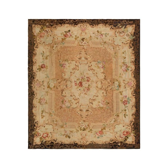 This antique French Aubusson carpet, dating to circa 1880–1920, reflects a continued appreciation for the timeless...
