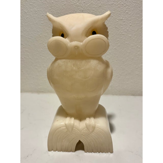 This mid-century stylized, anthropomorphic owl design has prominent circular glasses around its inlaid yellow glass eyes...