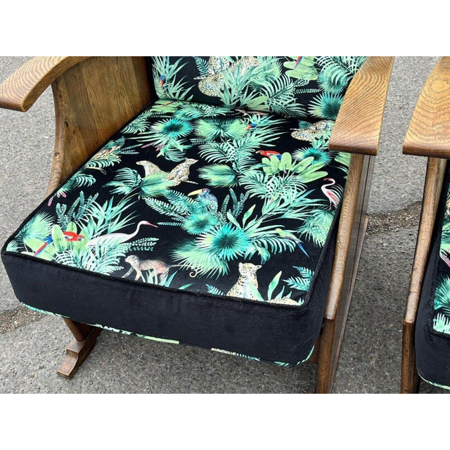 Pair Of 1930s Oak Armchairs Newly Upholstered In A Bright Jungle Print. Very stylish shape. Sizes :- 111 cms high 59 .5...