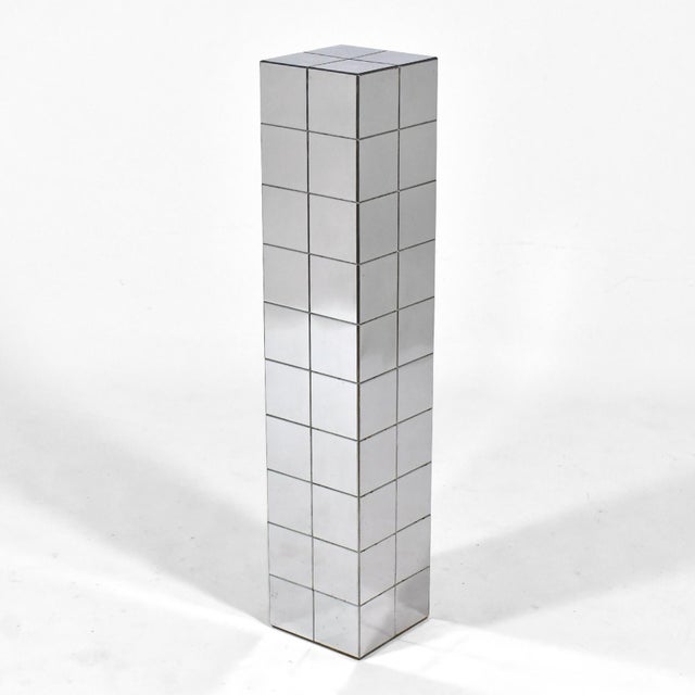 With its patchwork of chrome plates, this pedestal has a similar quality to Paul Evans' "Cityscape" designs for Directional.