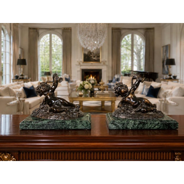 An exceptional pair of vintage bronze Bacchic putti bookends executed in the manner of Auguste Moreau, the French sculptor...