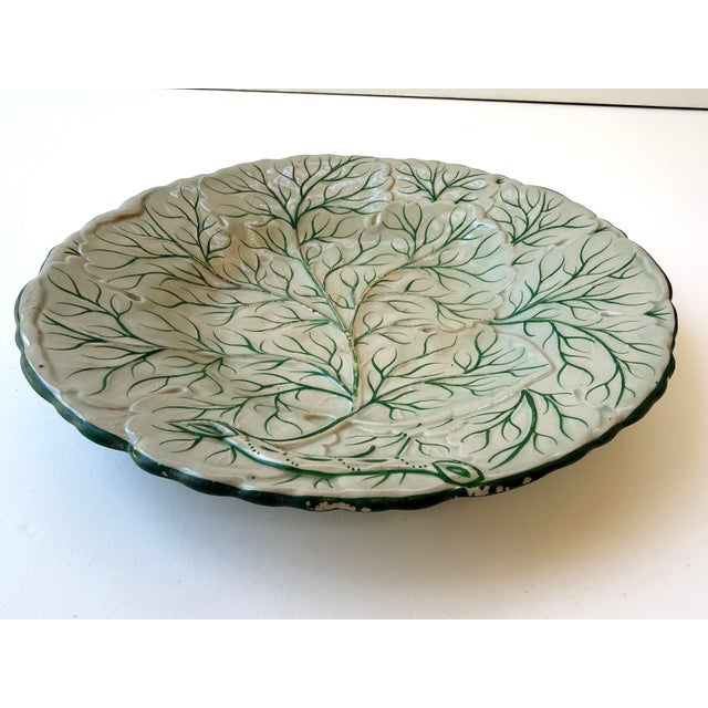 Featuring a crisp white glazed surface with hand-painted green veining, this highly sought-after design is an elegant...