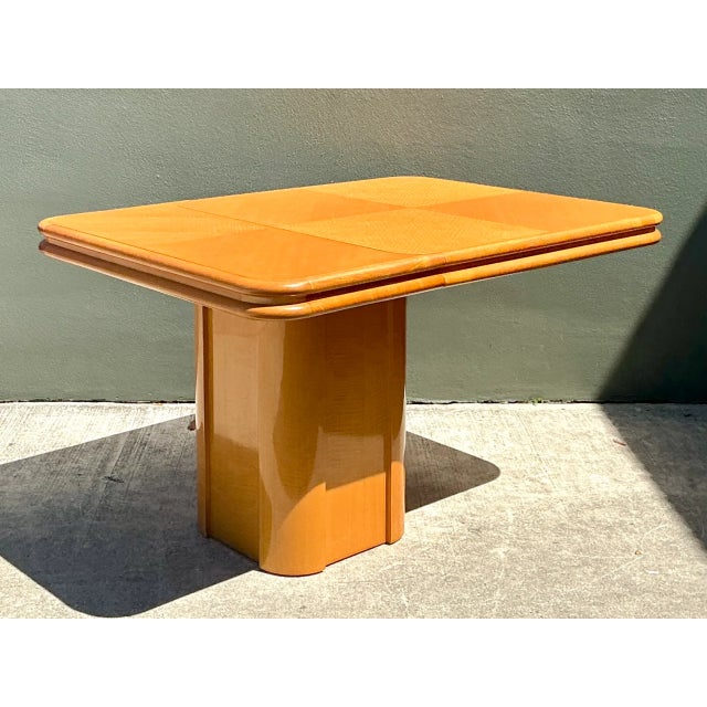 Showcasing sophisticated mid-century geometric design, this vintage extendable game table features a square tabletop...