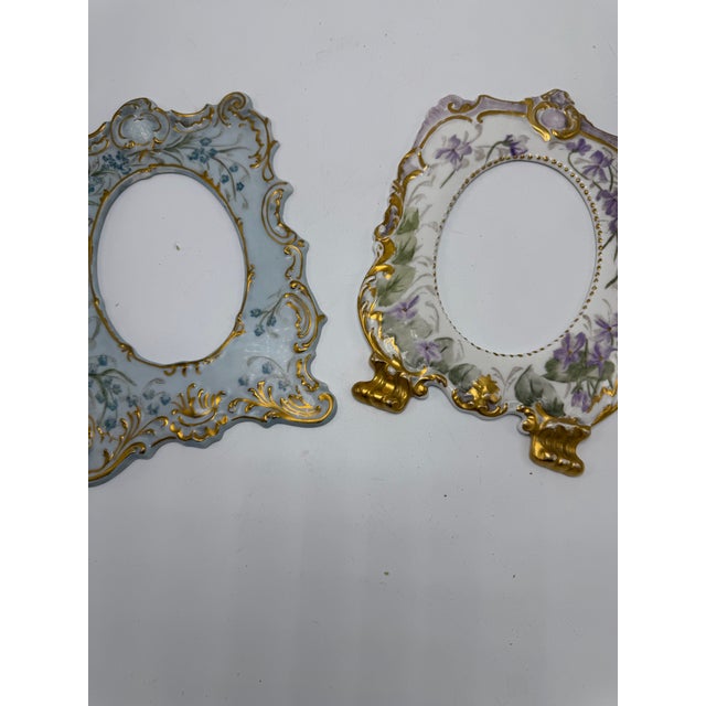 This is a lovely pair of antique hand-painted porcelain picture frames, dating to the late 19th century, with wonderfully...