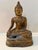 Vintage Thai bronze Buddha statue featuring a serene expression and classic seated form. This sculptural piece showcases...
