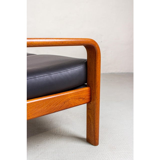 A two-seater sofa by Olsen & Laursen, made in Denmark in the 1980s. The frame is crafted from teak, with organically...