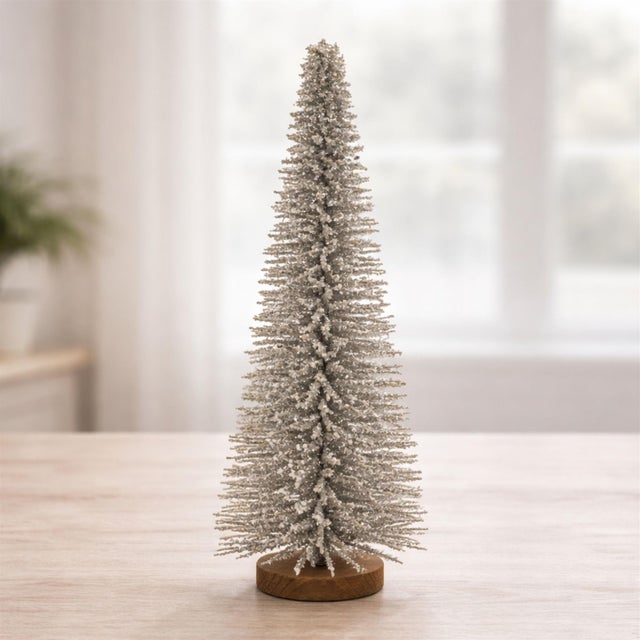 Add a touch of glamorous sparkle to your holiday décor with this 23.5-inch gold glitter Christmas tree, designed to...