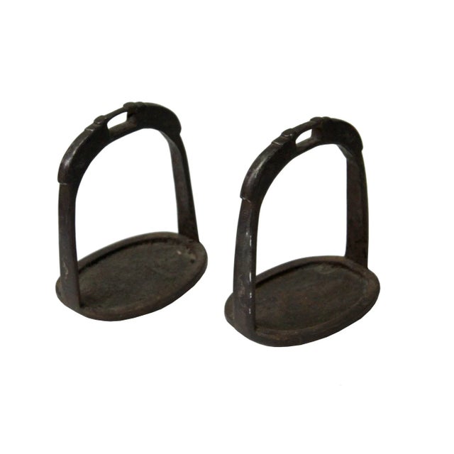 This pair of Chinese minority tribe horse stirrup is made of iron. It has a unique character that is great for home and...