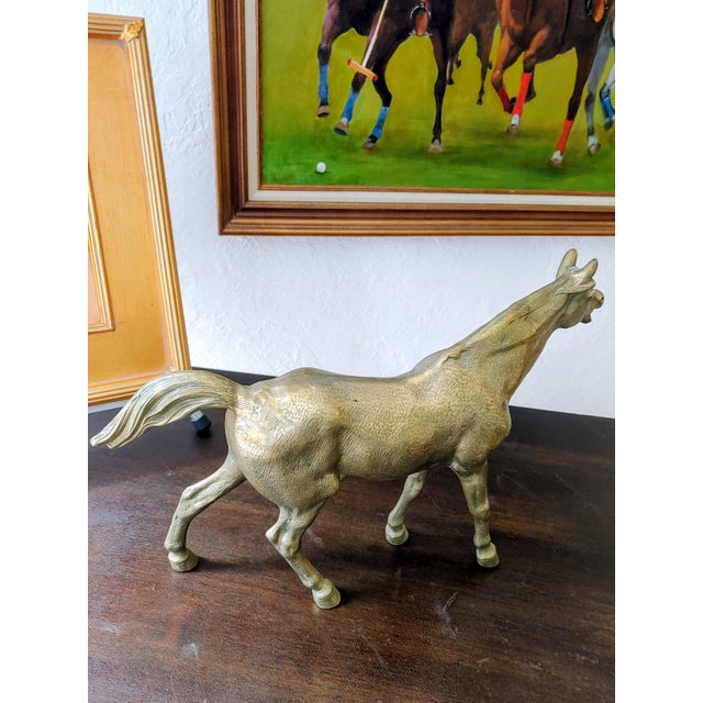 Here's a stunning heavy cast brass horse for mantle, shelf or desk top. Naturally patinated, it's a fine looking figure...