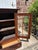 Small and charming country kitchen pine cupboard with 3 shelves, 1 drawer and glass door. Faux painted. Brass latch.