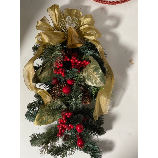 Handmade Christmas swag with blown glass gold angel figurine.