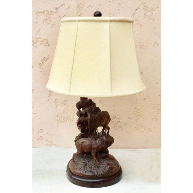 Large black forest lamp with two mountain goats on a rack, circa 1880. Electrified and wired for US, include shade.