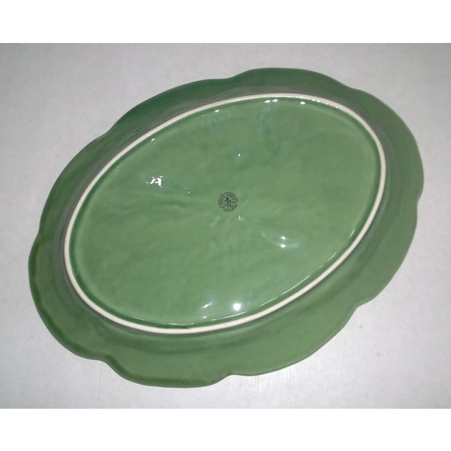 Add a touch of vintage charm and artistry to your table with this stunning Bordallo Pinheiro cabbage leaf serving platter....