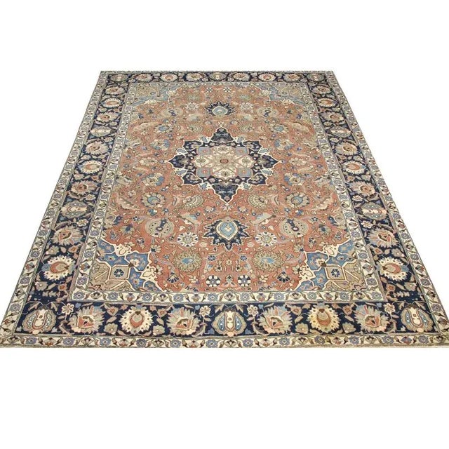 ACTUAL SIZE: 9’5″ x 12’5″ PRIMARY COLOR: Rose / Blue AGE: Old MATERIALS: Wool FOUNDATION: Cotton PRODUCTION: Handwoven,...