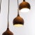 Elegant dome pendant light with seven drop-shaped shades in dark-brown metal with chromed brass mounting. With this light...