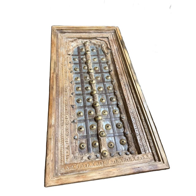 Rich in heritage and handcrafted detail, this antique Indian coffee table is created from a beautifully carved solid wood...