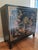 Beautiful black lacquered with unique door hardware that latches. One interior shelf that is fixed at 13" high from the...