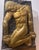 Bold and monumental, this striking relief depicts the mythological figure Prometheus Bound, shown nude and kneeling with...